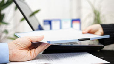 A person being served legal documents by a Brisbane process server.